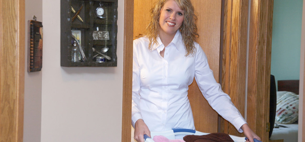 Caregiver with laundry basket